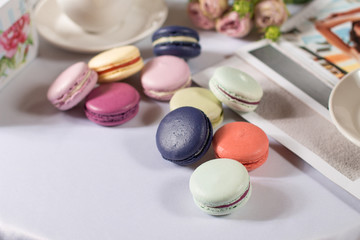 French colorful macarons pastel color pasta on a white background