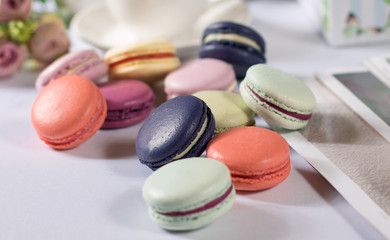 French colorful macarons pastel color pasta on a white background