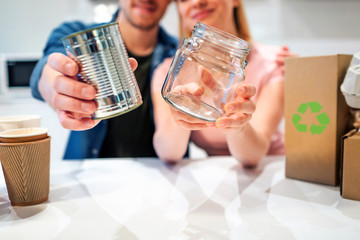 Recycling. Metal tin can and glass are prepared for recycling close-up