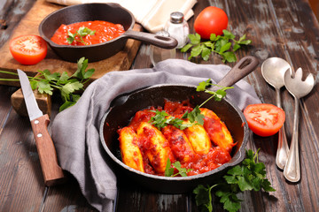 quenelle with tomato sauce