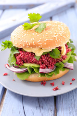 vegetarian burger with beet and lettuce
