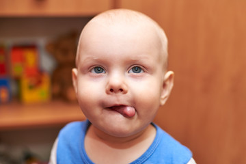 Portrait of a funny boy who grimaces