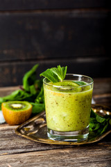 Fresh smoothie cocktail with kiwi fruit, mint and lime.