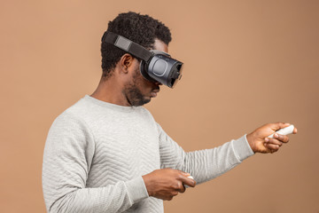 Man in VR glasses now is playing 3D game but Mankind stands on the threshold of a new era of...