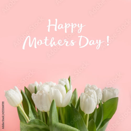May mothers day card. Border of white tulip on pastel millennial pink. Text - Happy Mothers day.