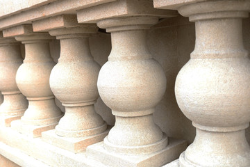White bannister pillars made of stone. Stone columns