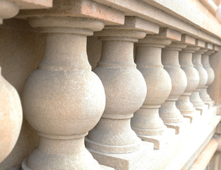 White bannister pillars made of stone. Stone columns