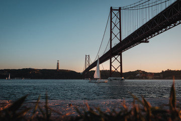 Fototapeta na wymiar view of the 25th April bridge at sunset in Lisbon, Portugal