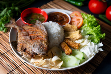 Fried pomfret fish and rice