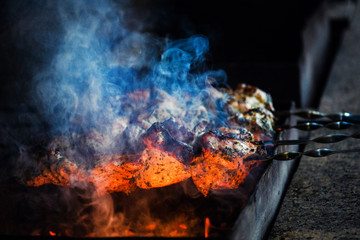 Juicy slices of meat prepare on fire