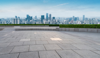 Urban skyscrapers with empty square floor tiles