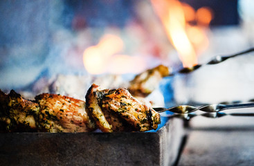 Juicy slices of meat prepare on fire