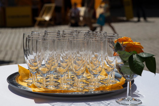 Empty champagne glasses  on a tray waiting to bee filled