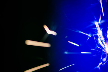 Sparks in the dark. Sparks. Christmas and New Year time. Magic light