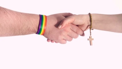 Christian woman and gay man shaking hands.