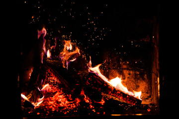 A glowing fire in the stone fireplace