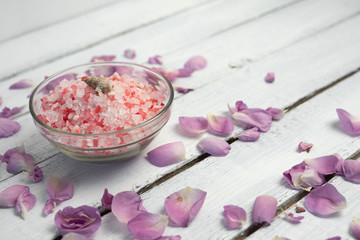Fototapeta na wymiar organic cosmetic with rose oil on white wood background