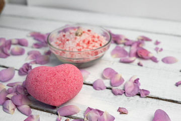 organic cosmetic with rose oil on white wood background