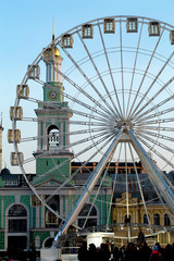 Ferris wheel. Kiev (Podol). The bell tower in the background
