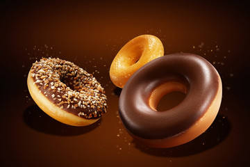 Flying donuts with chocolate glazed, sprinkled nuts and splatters of glaze. Sweet food concept....