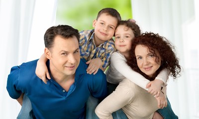 Beautiful smiling family on background