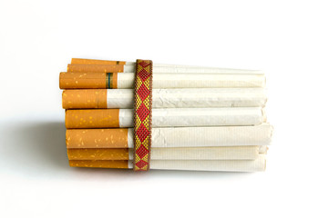 Many tobacco cigarettes tied with a rope on a white background. Many tobacco cigarettes tied with a rope on a white background.