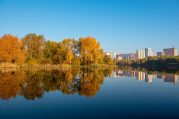 Image of the city on the background of the lake