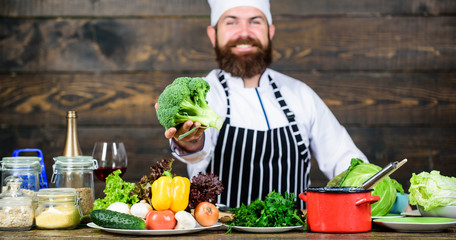 Organic food. Fresh ingredients only. Vegetarian meal. Man cooking fresh vegetables. Culinary...