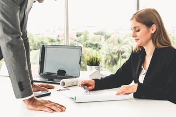 Architect and engineer working with construction drawing project on table in office. Architecture...