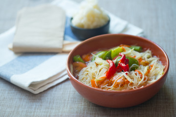Somtum or papaya salad with red hot chili and Thai herb sauce