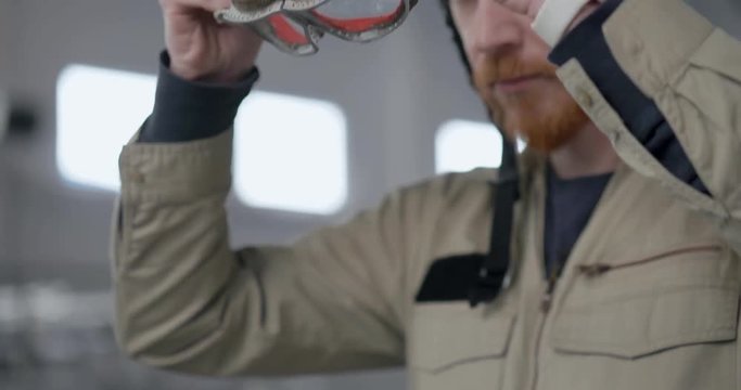 Portrait of red-bearded young pilot
