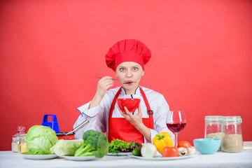 Free healthy vegetarian and vegan recipes. Healthy raw food. Dieting concept. Eat healthy. Girl wear hat and apron try meal taste. Healthy ration. Woman professional chef hold bowl and spoon