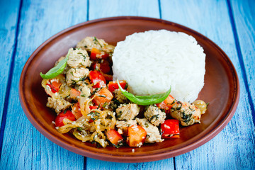 Chicken stir fry with vegetables and sesame served with rice