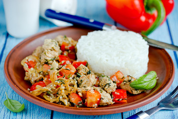 Chicken stir fry with vegetables and sesame served with rice
