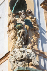 PRAGUE, CZECH REPUBLIK, SEPTEMBER 12, 2010: St. Michael baroque statue on the facade of house in Little quarter by Ottavio Mosto (1700).