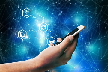 Hand holding smartphone, close-up view