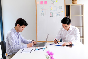 Young man designers planning work together on website ux app development.