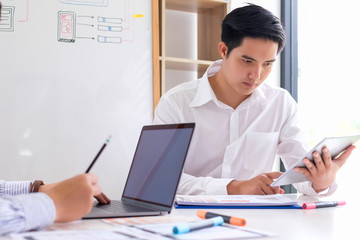 Young man designers planning work together on website ux app development.