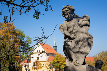 PRAGUE, CZECH REPUBLIC - OCTOBER 14, 2018: The baroque angel before facade of Loreto church  -...