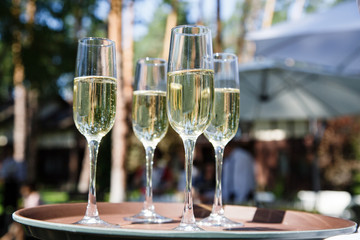 Glasses with champagne at a wedding outdor