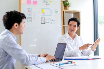 Young man designers planning work together on website ux app development.