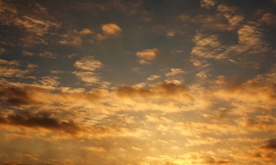 Landscape of colorful dramatic sky clouds in the rays of sunset light, beautiful nature background