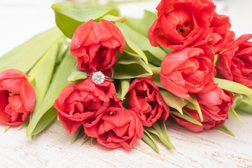 bouquet of tulips and engagement ring