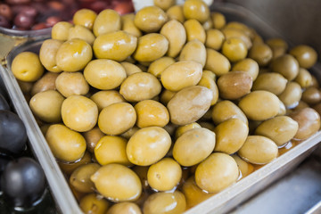 fresh healthy green and black olives for sale