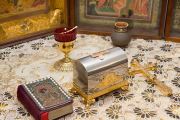 Church accessories with a cross on the background of icons