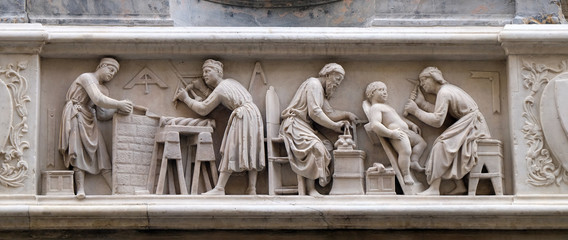 Detail of the sculptors and architects at work, bas-relief (detail of the tabernacle of the Four Crowned Saints) by Nanni di Banco, in Orsanmichele Church in Florence, Italy