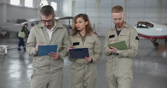 Three military pilots beginning their workday