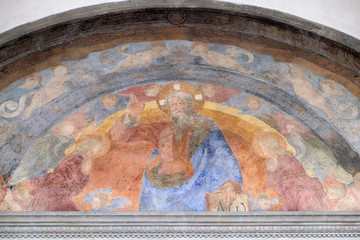Obraz na płótnie Canvas The Eternal Father and the Holy Innocents Martyrs, frescoed lunette by Giovanni di Francesco, Ospedale degli Innocenti - Exterior arcade, Florence, Italy
