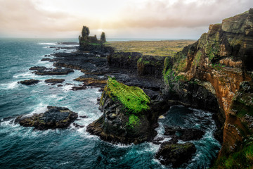 Londrangar in Snaefellsnes National Park, Iceland. Londrangar and hill Svalthufa are remains of a...