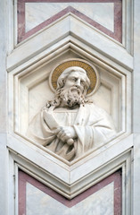 Fototapeta na wymiar Saint Bartholomew the Apostle, relief on the facade of Basilica of Santa Croce (Basilica of the Holy Cross) - famous Franciscan church in Florence, Italy
